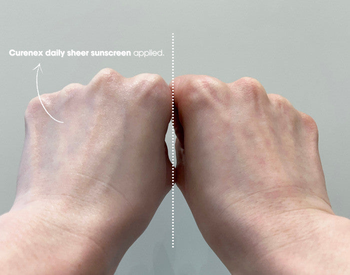 Hands applying sheer sunscreen with visible glossy coverage